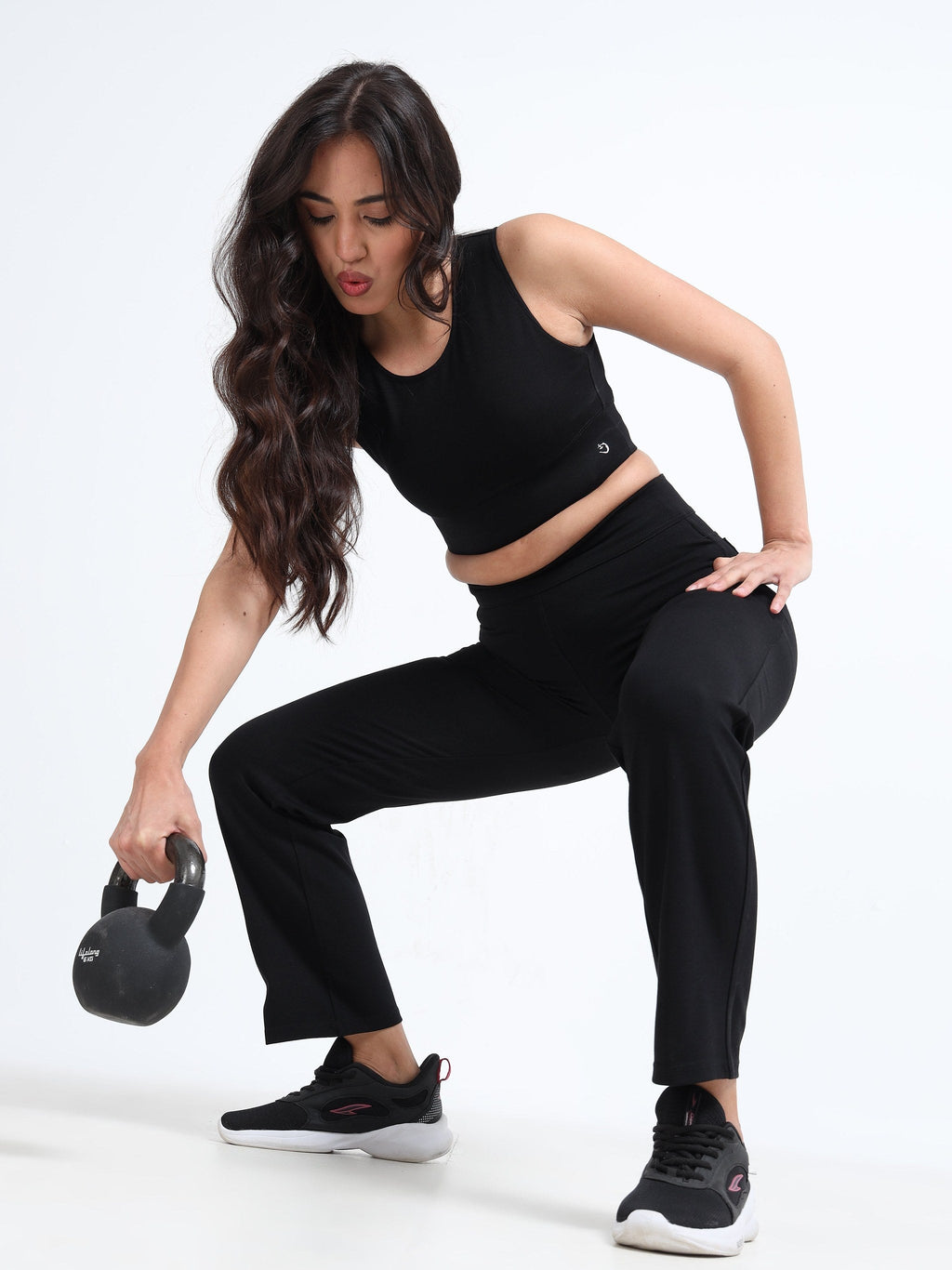 Yellowcrop black cutout sports bra, front view showing cutout panel design