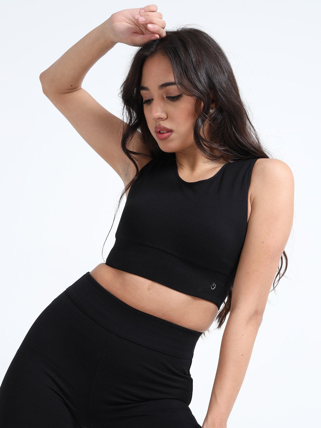 Black cutout sports bra side view on model