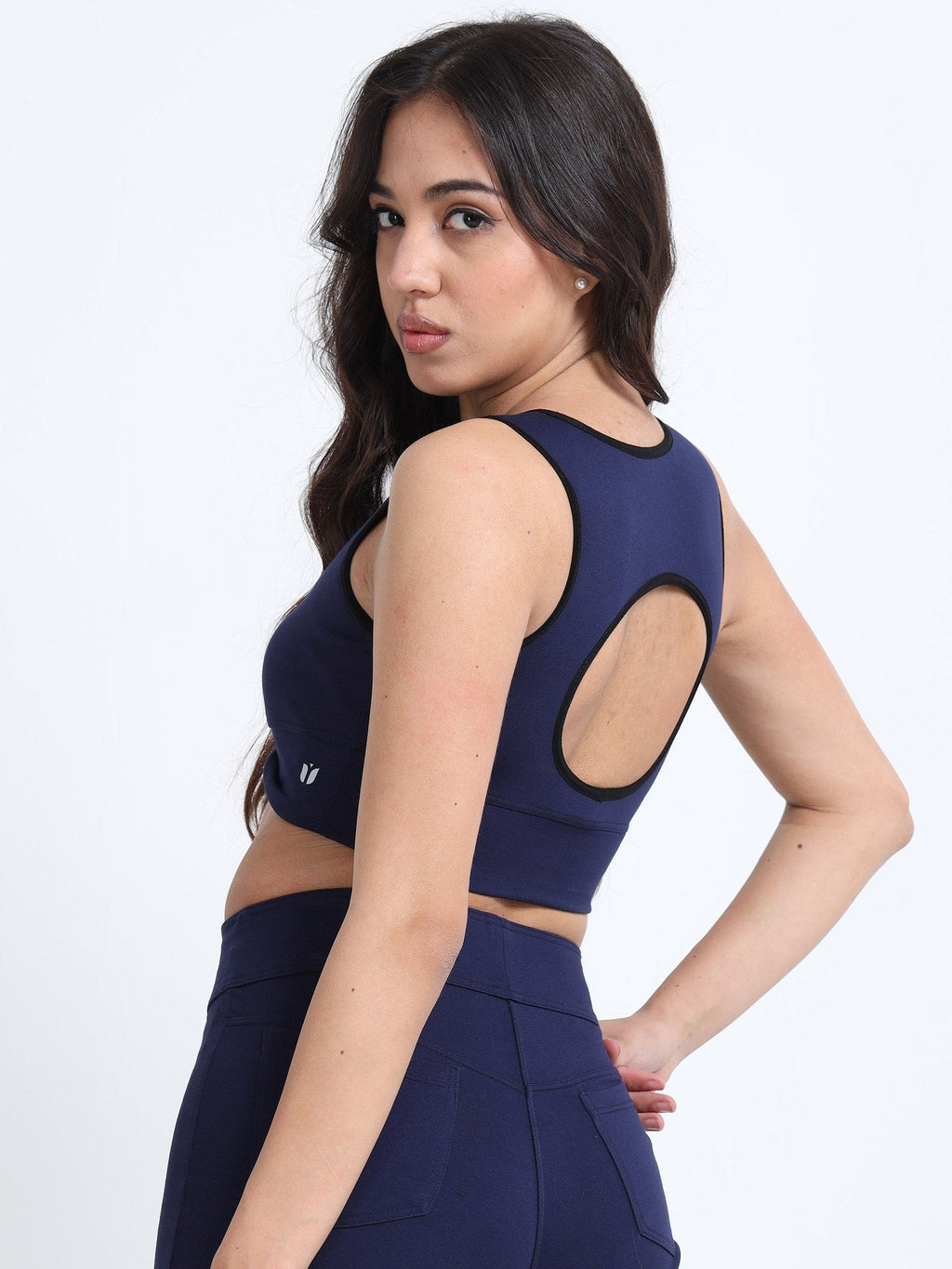 Navy cutout sports bra back view showing cutout panel design