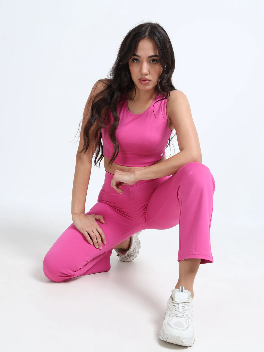 Close-up of pink cutout sports bra cutout panel and fabric detail