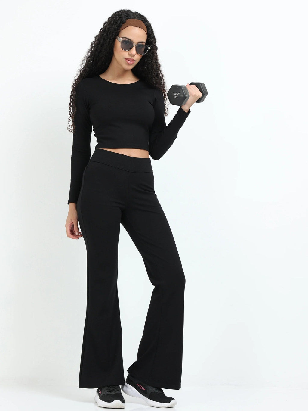 Black flare pants full-length shot showing complete high-waisted flare silhouette