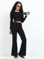 Black flare pants full-length shot showing complete high-waisted flare silhouette