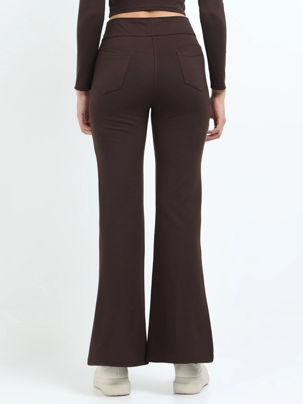 Brown flare pants back view showing back pockets and flare hem