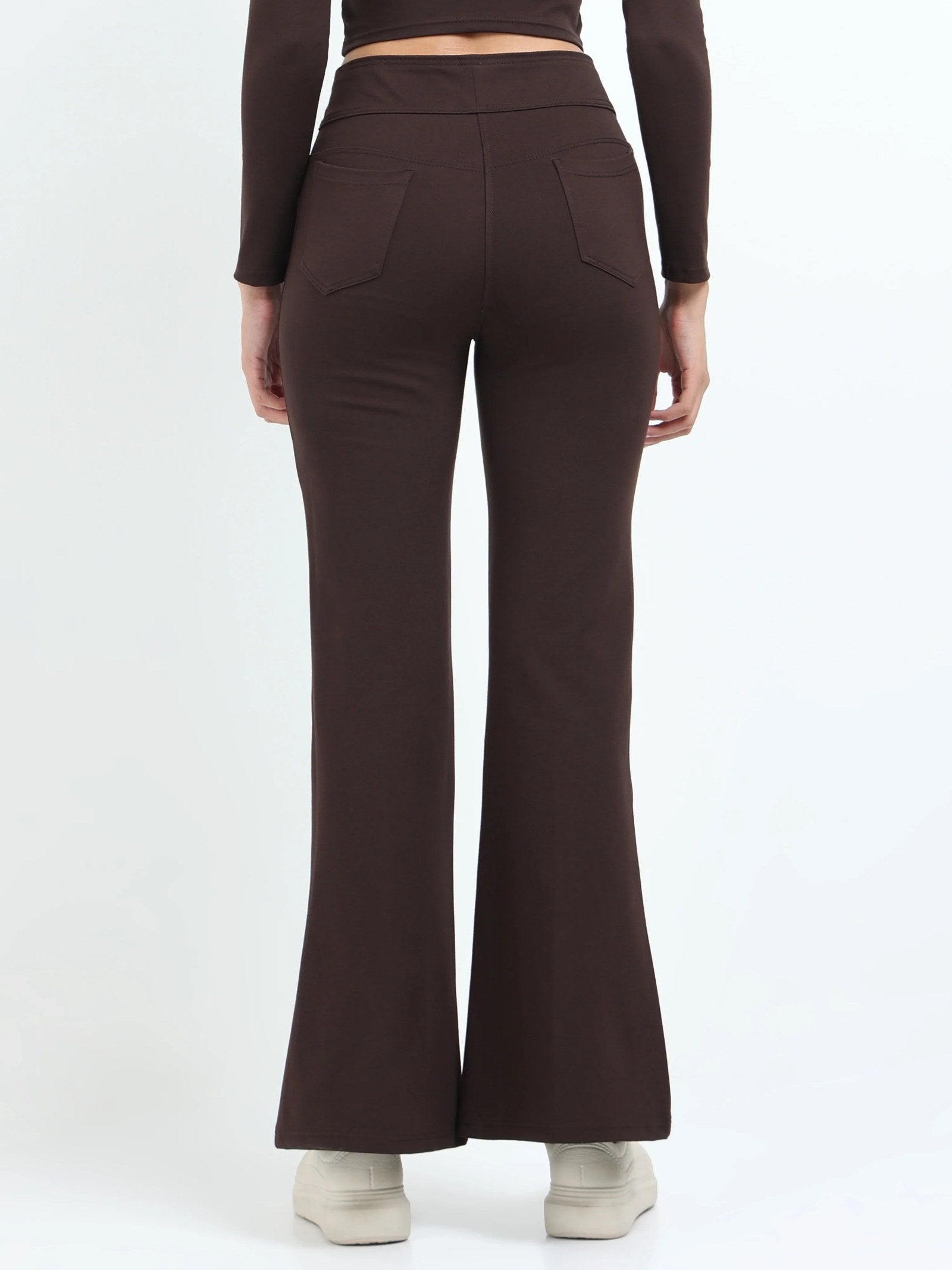Brown flare pants back view showing back pockets and flare hem