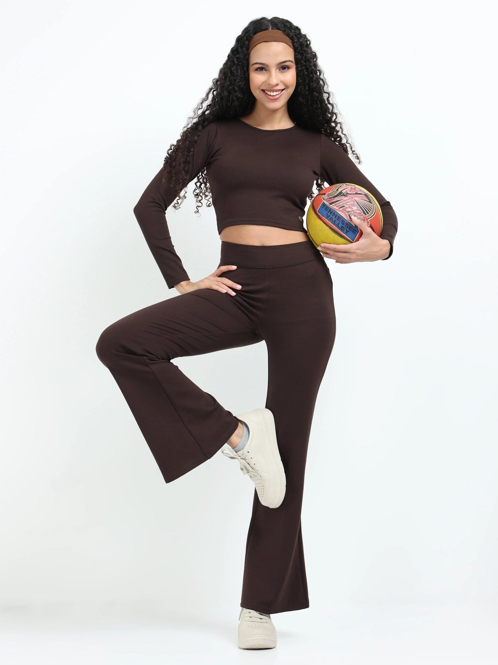 Brown flare pants full-length shot showing complete high-waisted flare silhouette