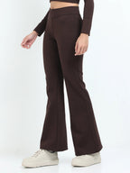Brown flare pants side view showing high-waisted fit and wide flare leg