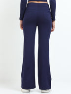 Navy flare pants back view showing back pockets and flare hem