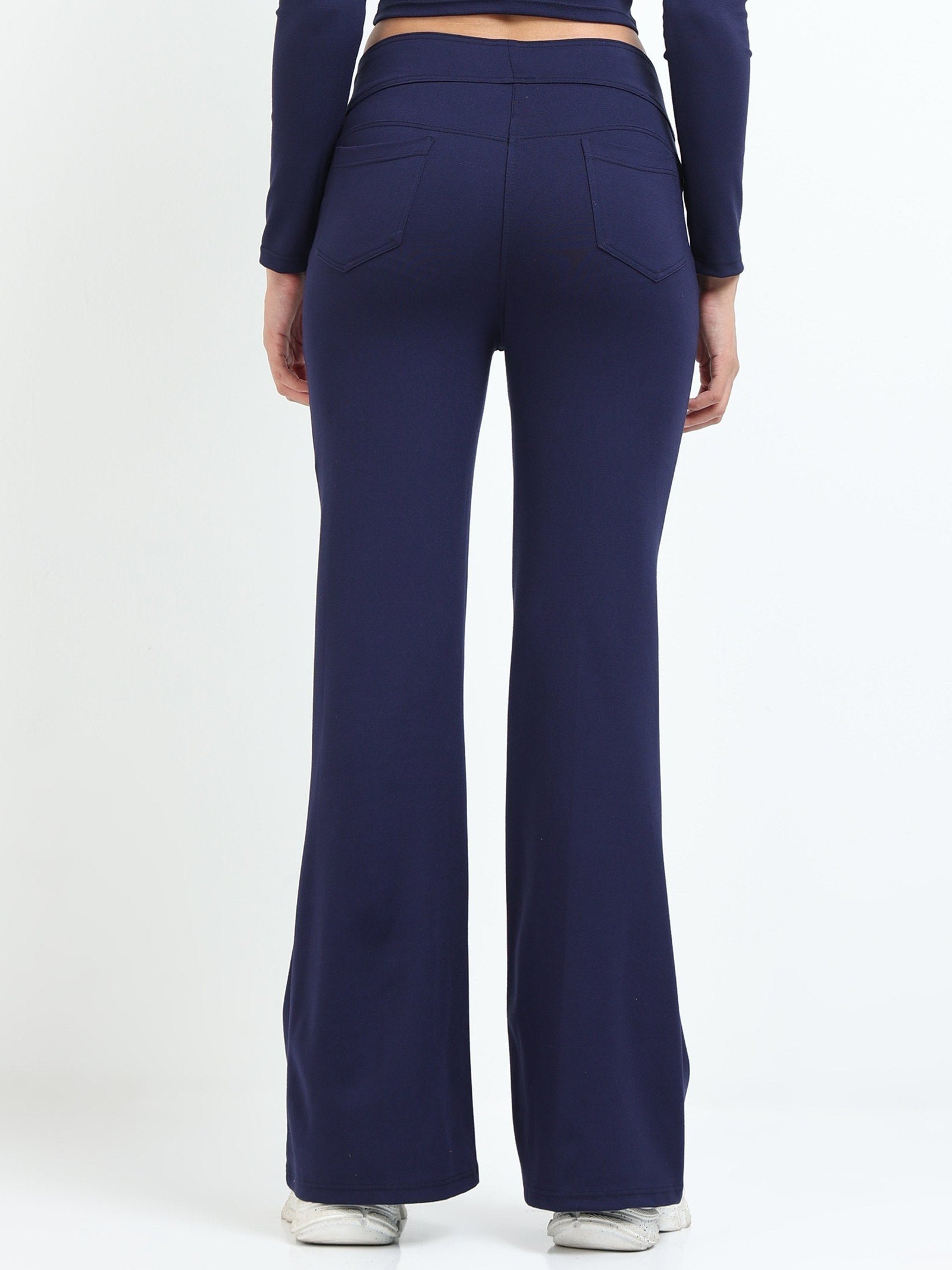 Navy flare pants back view showing back pockets and flare hem
