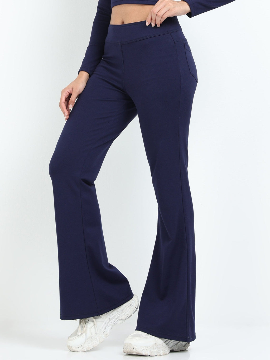 Navy flare pants side view showing high-waisted fit and wide flare leg