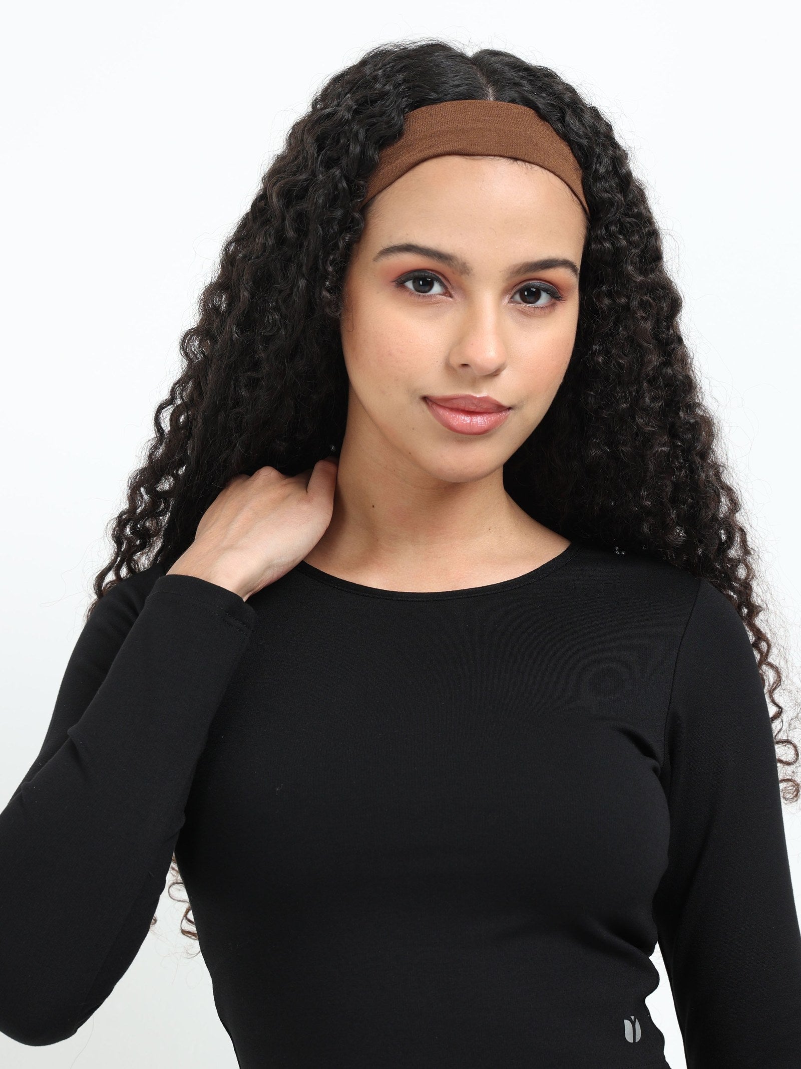 Black long sleeve crop top side view showing fitted waist-length silhouette