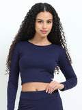 Yellowcrop navy long sleeve crop top, front view on model with hand on hip