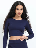 Yellowcrop navy long sleeve crop top, front view on model with hand on hip