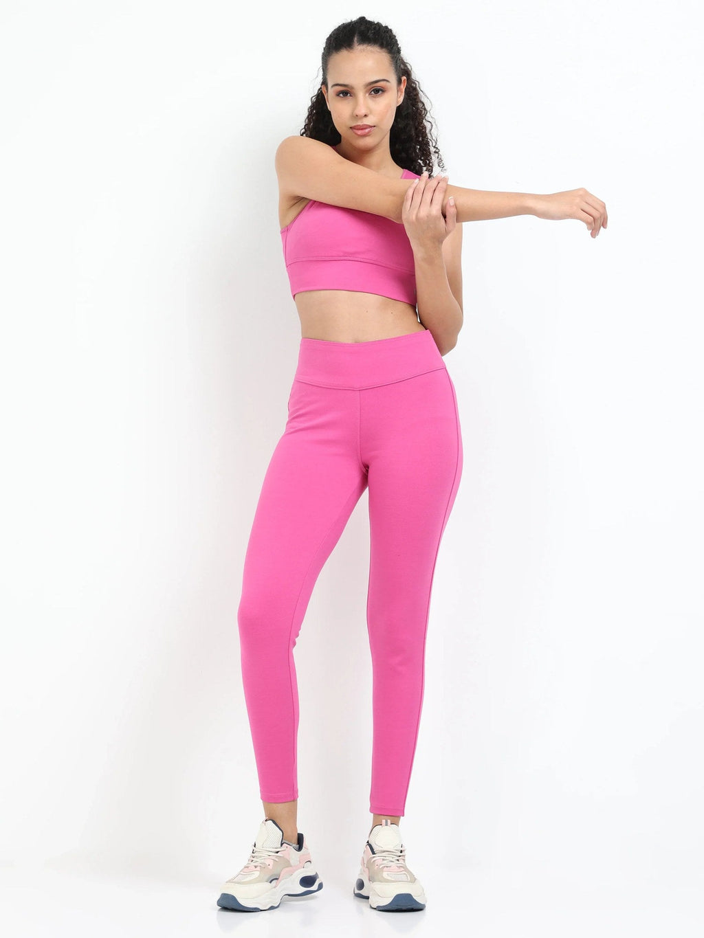Pink sculpt jegging back view showing fitted seat and wide waistband