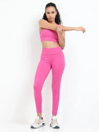 Pink sculpt jegging back view showing fitted seat and wide waistband