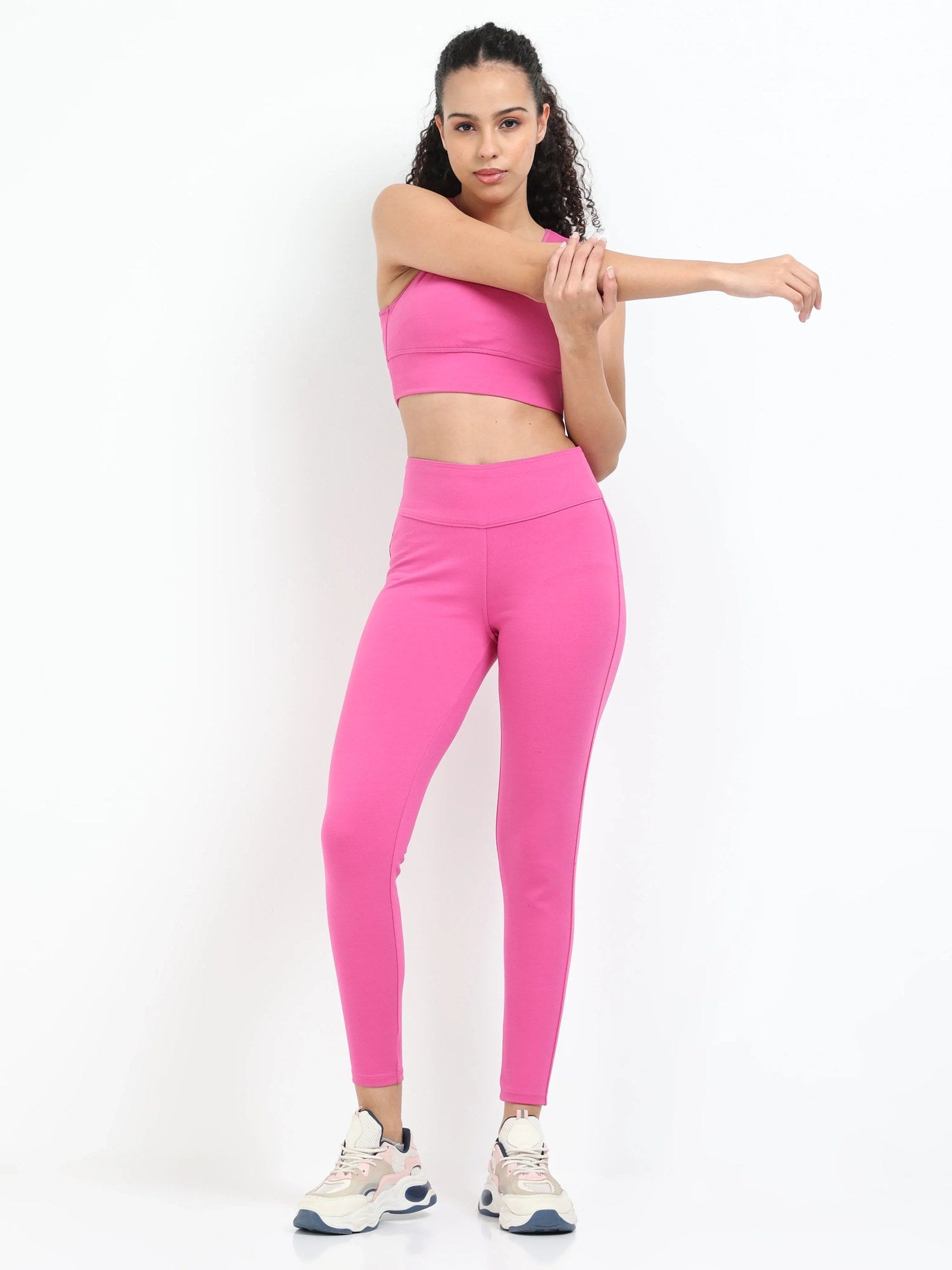 Pink sculpt jegging back view showing fitted seat and wide waistband