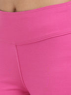 Close-up of pink sculpt jegging high-rise waistband detail