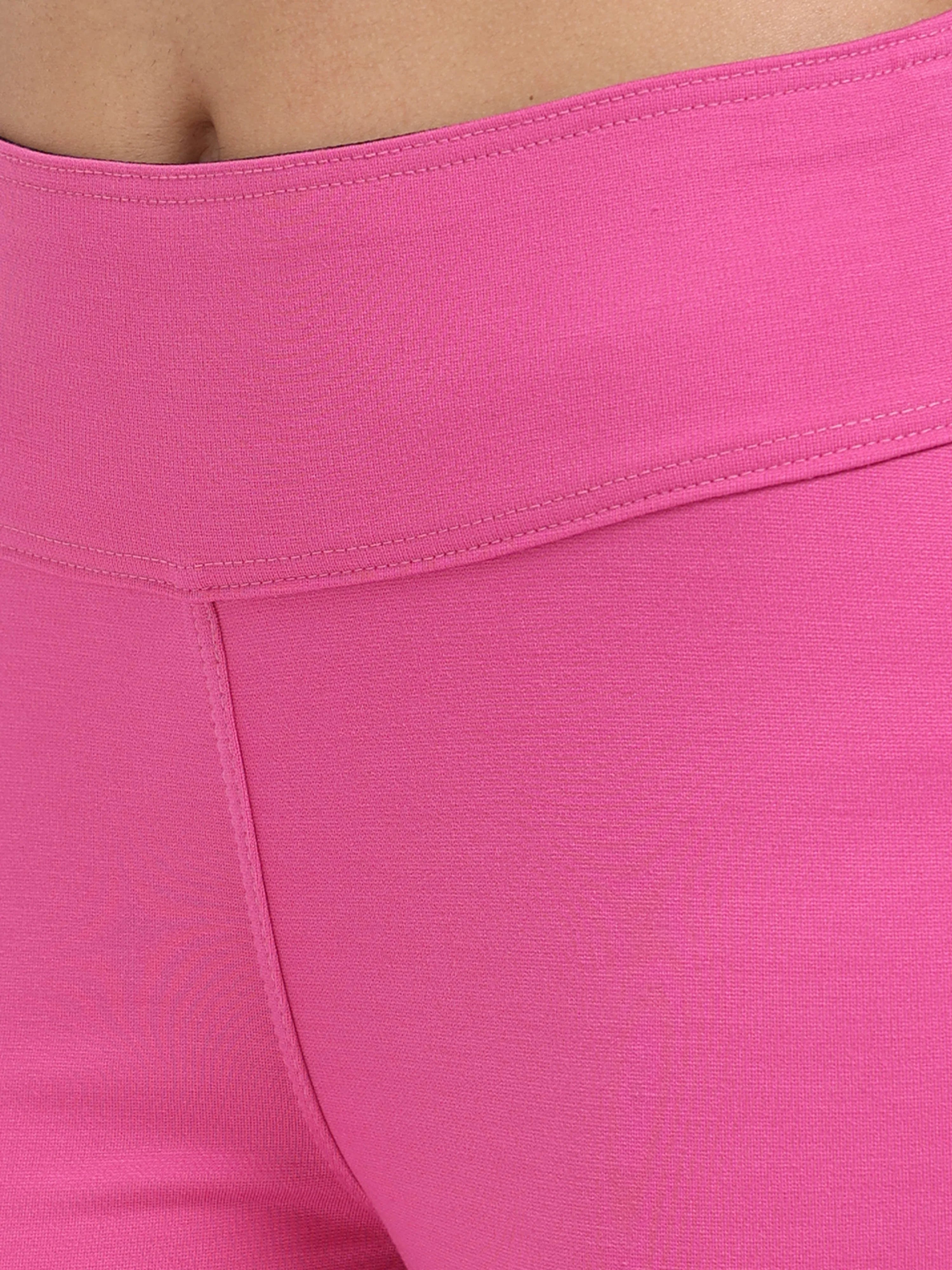 Close-up of pink sculpt jegging high-rise waistband detail