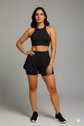 Yellowcrop black athletic skort, front view showing pleated skirt over built-in shorts