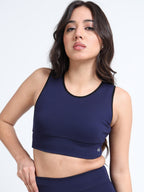 Navy sports bra back view showing racerback design