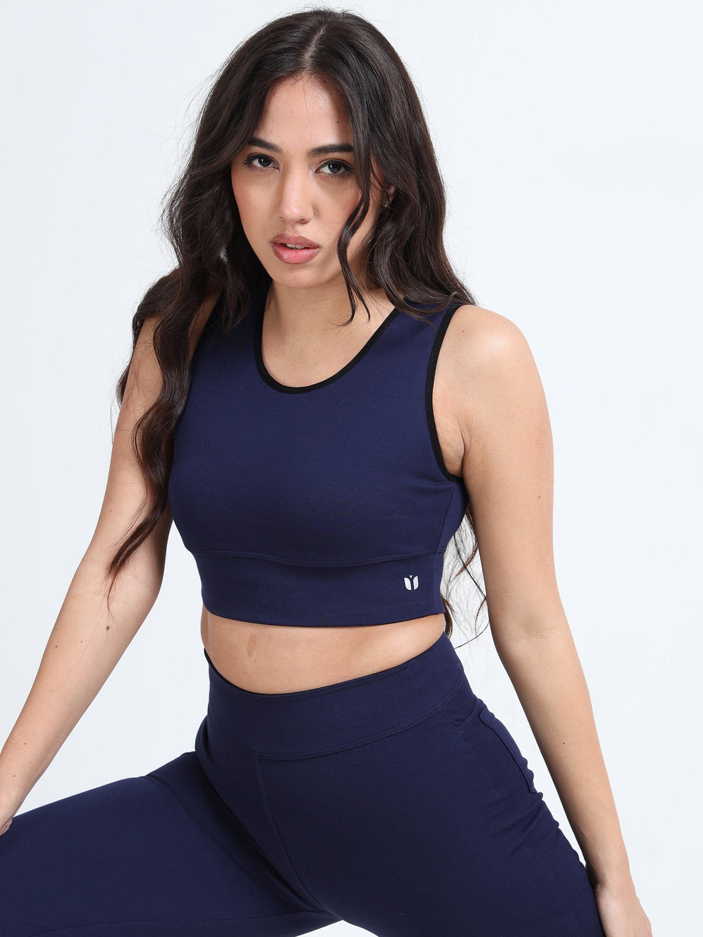 Yellowcrop navy sports bra, front view on model