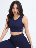 Yellowcrop navy sports bra, front view on model