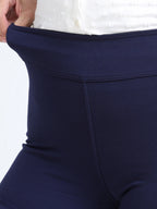 Close-up of navy straight pants high-rise waistband detail